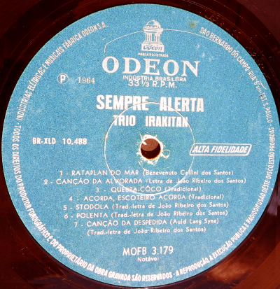 Selo do lado B do  LP Sempre Alerta, gravado pelo Trio Irakitan, em 1964.
